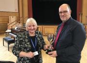 Judge Andrea Calladine presenting the Eva Preece Cup to Mike Gearey